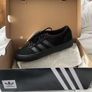 Brand new Men’s Adidas. Size 7